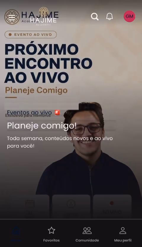 Tela inicial do aplicativo da Hajime Academy anunciando o próximo encontro ao vivo Planeje Comigo, com a aba Comunidade na barra inferior.